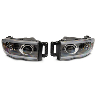 Raxiom 02-05 Dodge RAM 1500/2500/3500 Axial LED Projector Headlights- Blk Housing (Clear Lens)