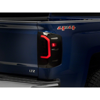 Raxiom 14-18 Chevrolet Silverado 1500 Axial Series LED Tail Lights- Blk Housing (Smoked Lens)