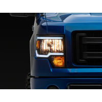 Raxiom 09-14 Ford F-150 Axial Series Headlight w/ SEQL LED Bar- Blk Housing (Clear Lens)