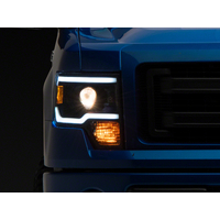 Raxiom 09-14 Ford F-150 Axial Series Projector Headlights w/ LED Light Bar- Blk Housing (Clear Lens)