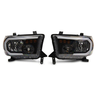 Raxiom 07-13 Toyota Tundra Axial Series Headlights w/ LED Bar- Blk Housing (Clear Lens)