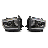 Raxiom 14-21 Toyota Tundra Axial Series Projector Headlights w/ LED Bar- Blk Housing (Clear Lens)